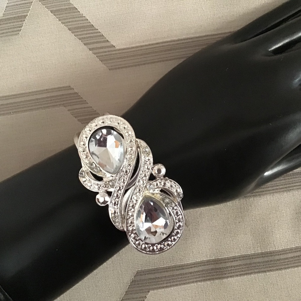 Silver color cuff with two large clear beads and small ones to add sparkle